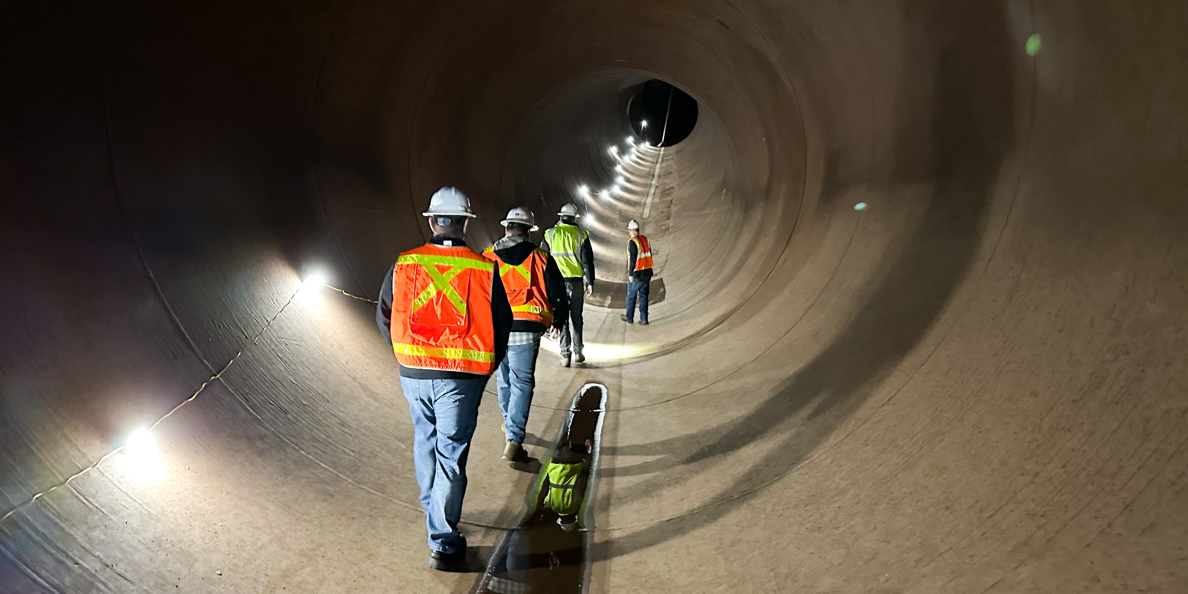 Reclamation crew inspecting the New Melones Powerplant Multi-Purpose Tunnel