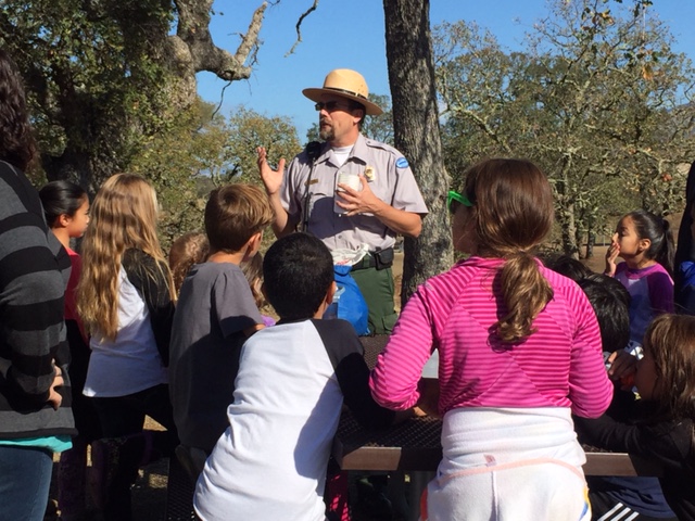  A park ranger shares about the water cycle to students visiting Lake Berryessa.