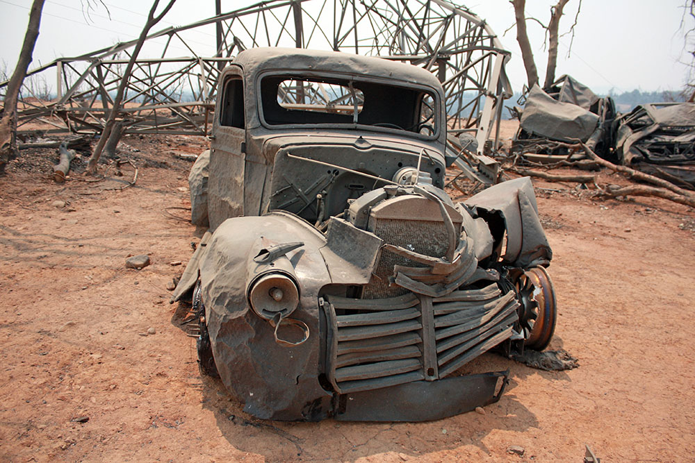 Carr Fire affected vehicle and power-tower near Redding, California