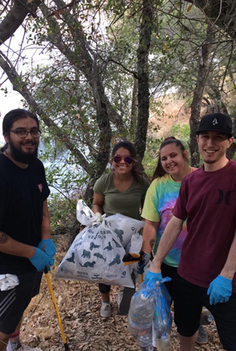 Volunteers posed while picking up trash at Markley Cove.