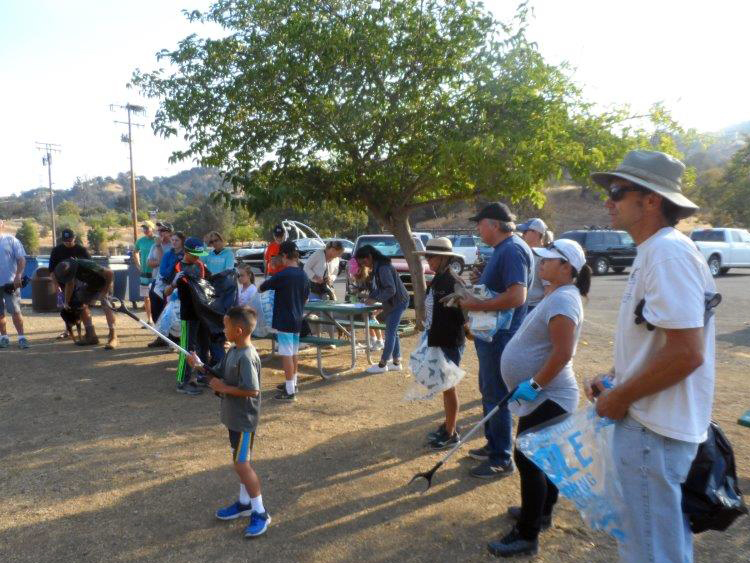 Volunteers listen to safety briefing before starting to cleanup.