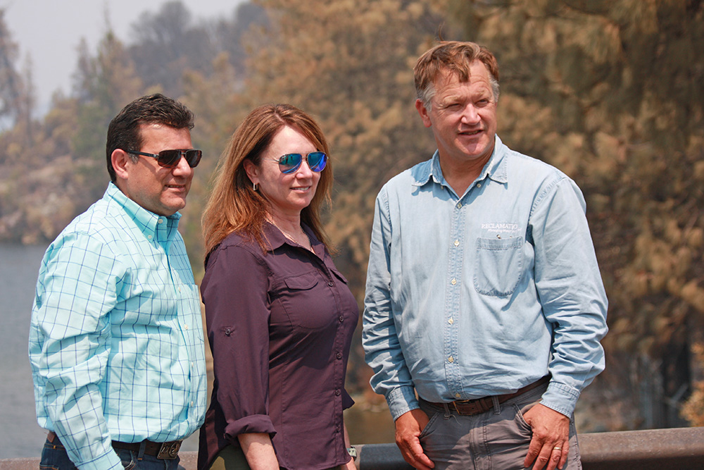 Reclamation Commissioner Brenda Burman surrounded by Mid-Pacific Region leadership near Redding, California.