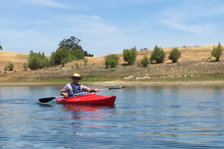 Kayaker near the shores of Lake Berryessa.