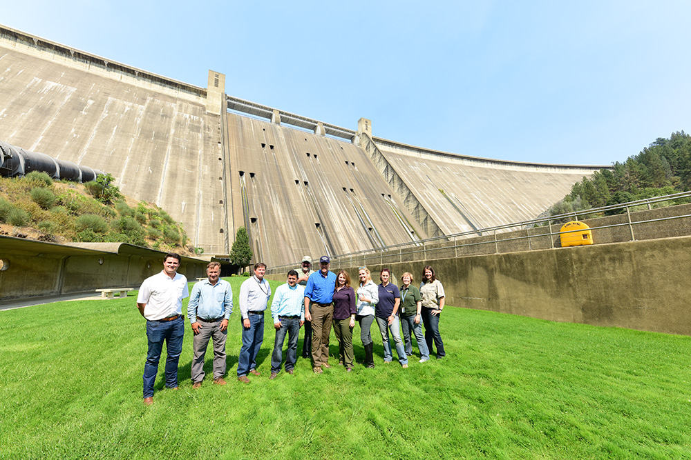 Interior Secretary Ryan Zinke, Reclamation Commissioner Brenda Burman and others in front of Shasta Dam.