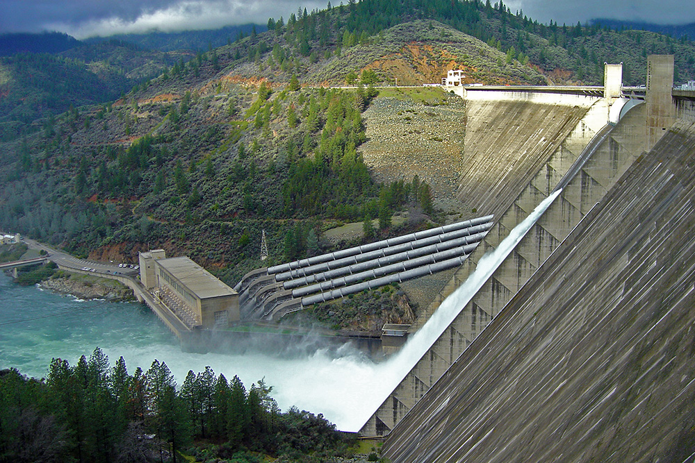 Shasta Dam releasing 50,000 cfs because it can't hold more Shasta Dam aerial photograph
