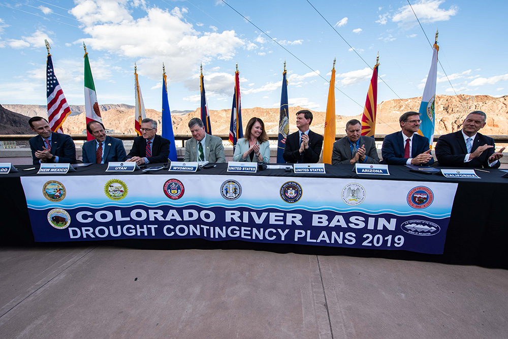 ASWS Petty and Commissioner Burman and principles from each of the Colorado River Basin States signing the DCP at Hoover Dam.