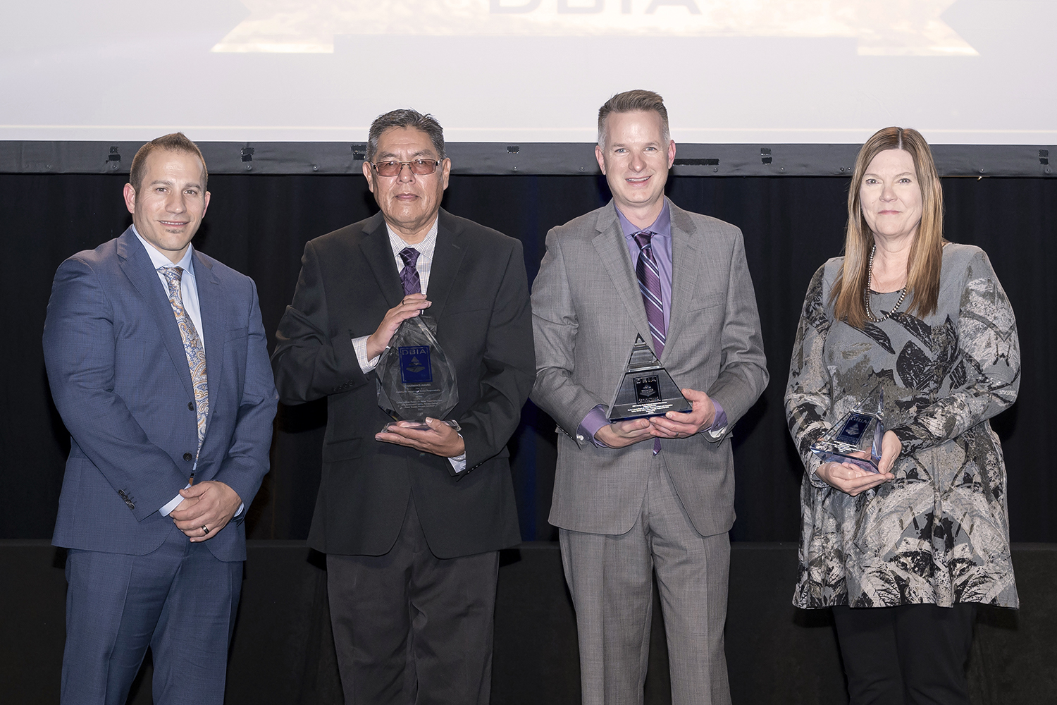 (R-L) Ted Michaelidis, Jacobs Project Manager; Robert Kirk, Navajo Nation Department of Water Resources Principal Hydrologist; Bart Deming, Reclamation Four Corners Construction Office Deputy Construction Engineer; and Jill Petersen, Jacobs Project Engineer
