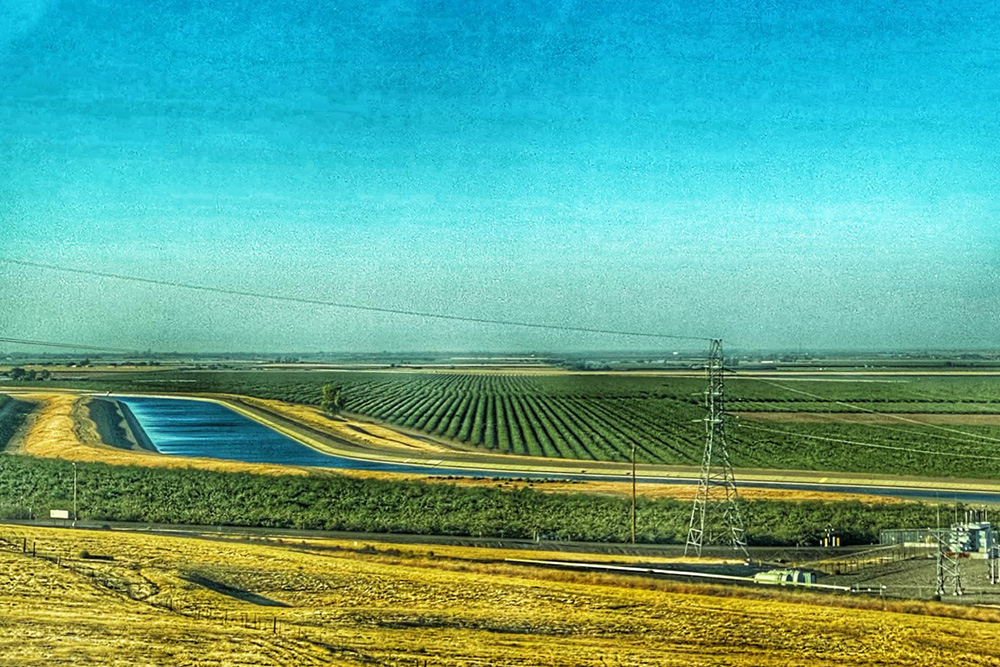 Central Valley Project canal with agriculture and powerlines (USBR/Mary Lee Knecht)