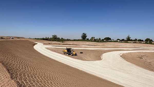 Heavy equipment sits at the bottom of one of the settling channels in the Holtville Alamo River Wetlands Project before water diversion began. 📸 / Tim Dewar 