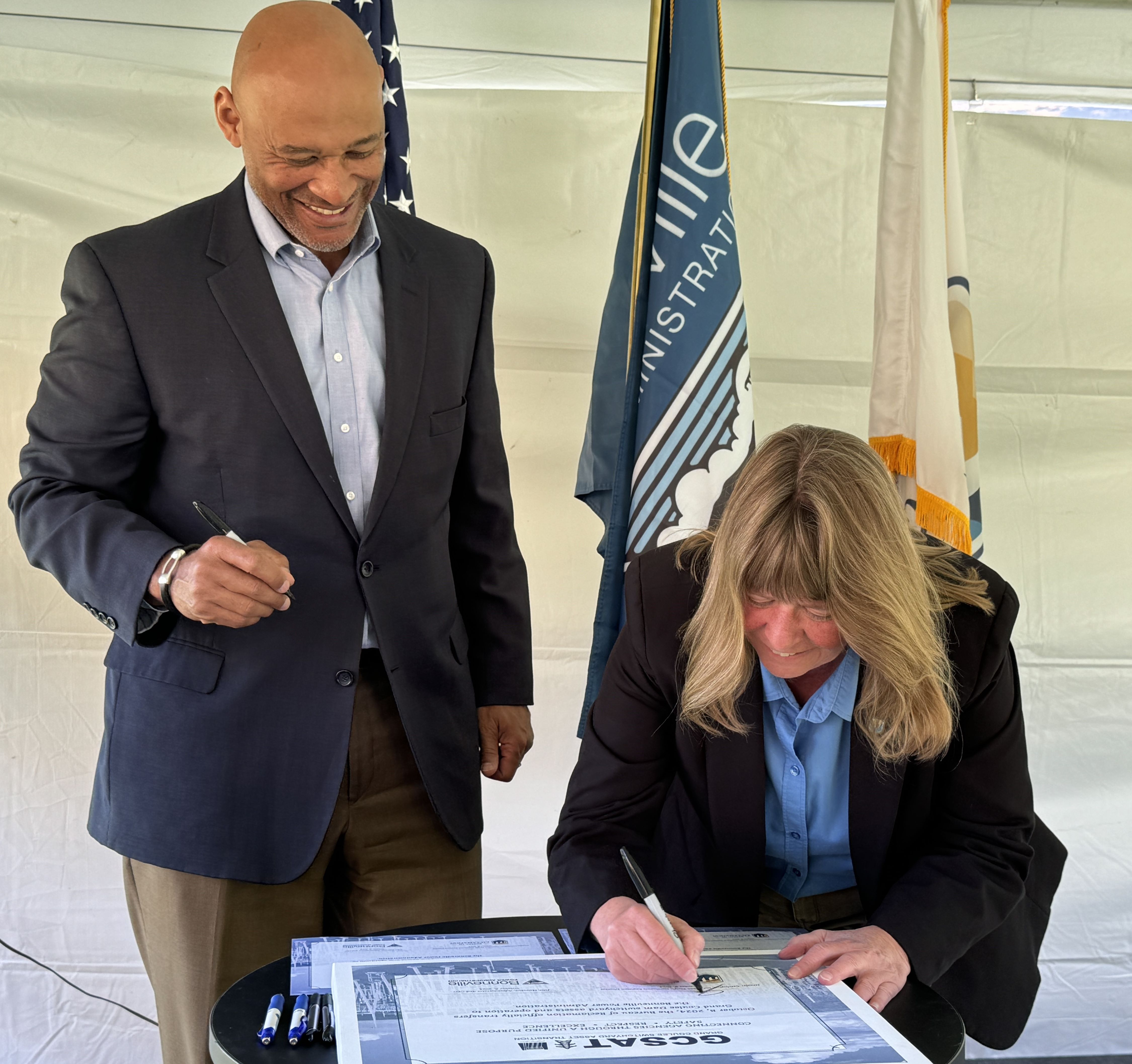 John Hairston, BPA’s CEO and Administrator, and Jennifer Carrington, Reclamation’s Columbia–Pacific Northwest Regional Director sign transfer agreement. 