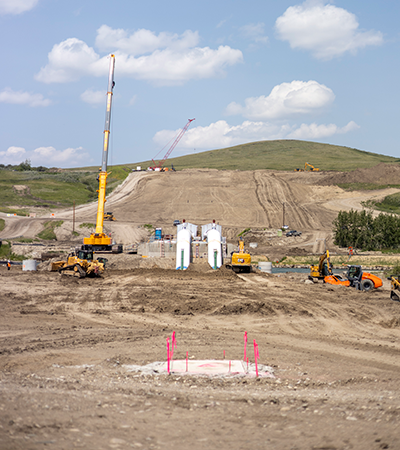 Crews perform work at the site of the newly completed St. Mary Canal Siphons near Babb, MT.