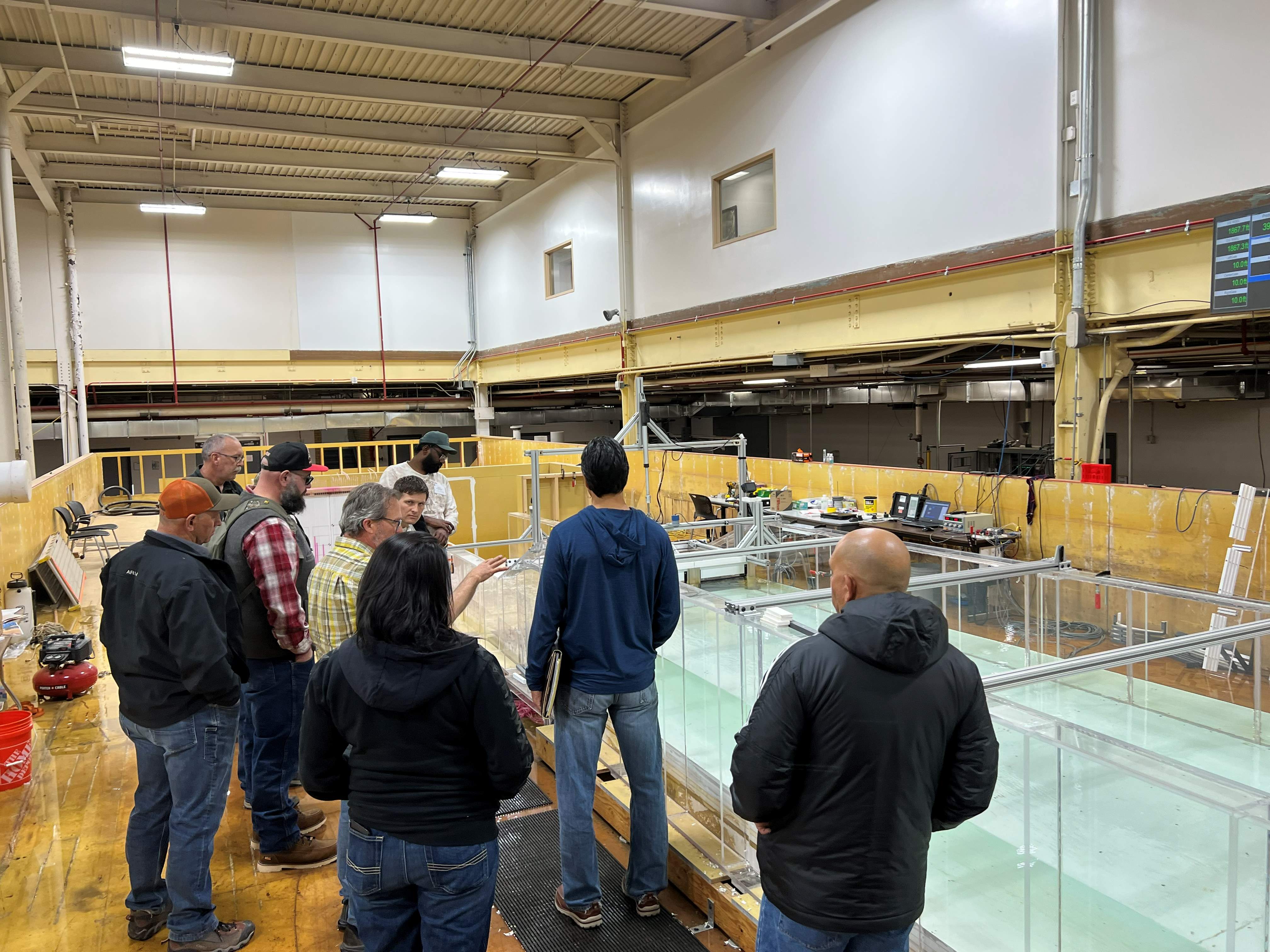 The Technical Service Center hydraulics lab demonstrates how a dam model is used to test hydrologic loading on spill gates. 