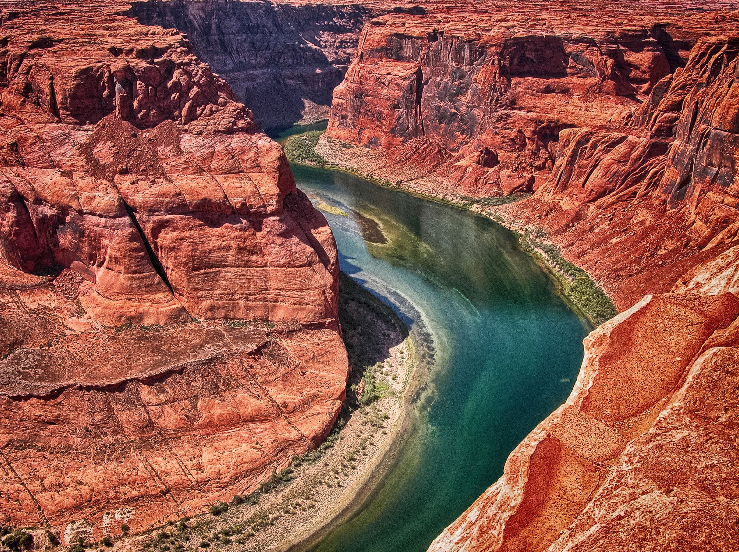 Photo of Colorado River with canyon landscape and river water.