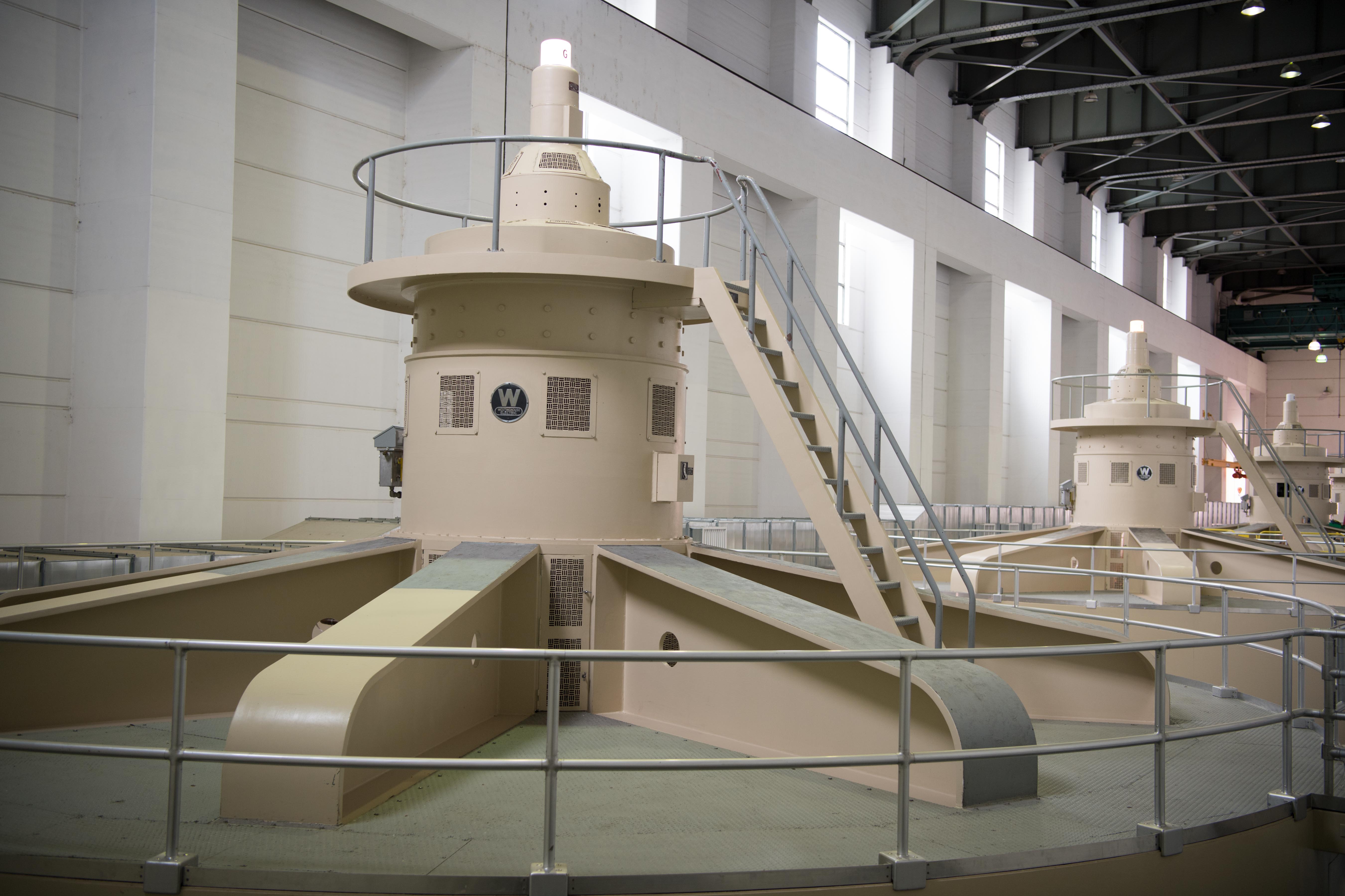 A row of hydropower turbines