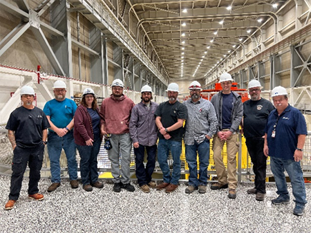 Current and past apprentices from Glen Canyon Dam and Power Plant stand together for a group photograph