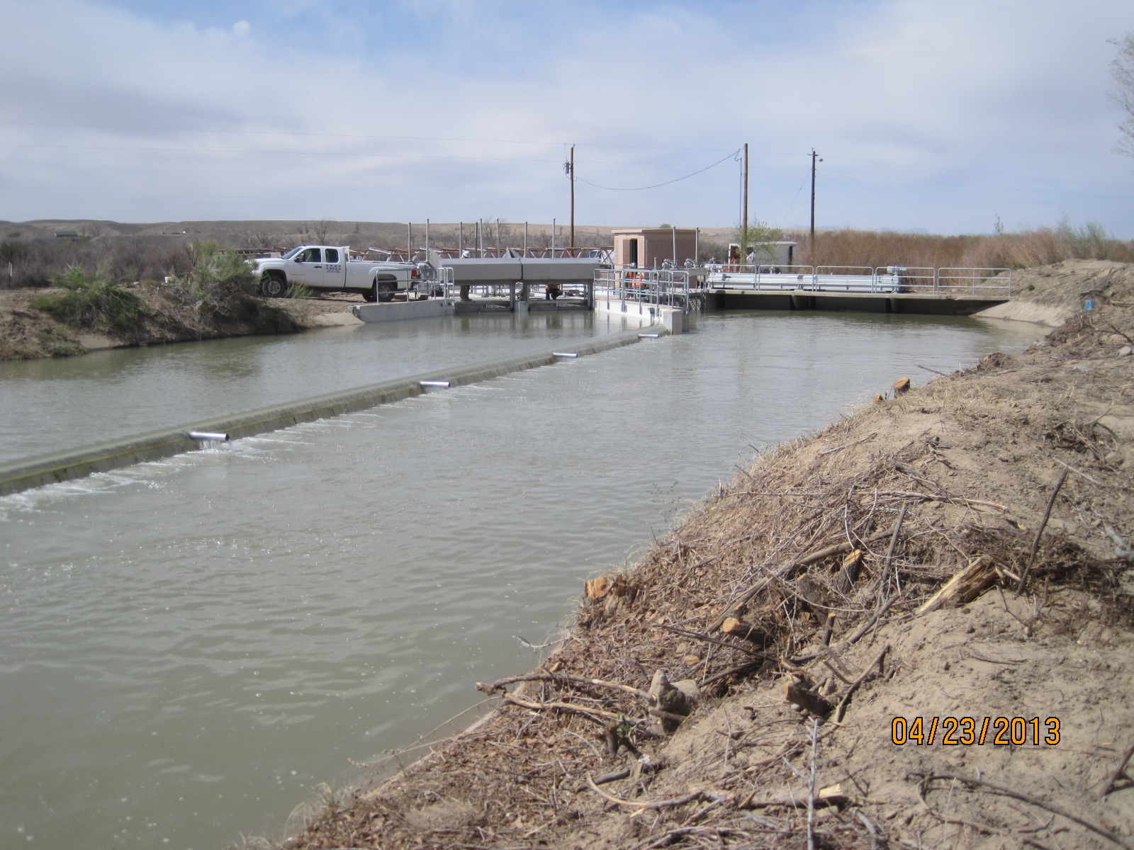 Hogback Fish Weir.  Fish travel down next to the weir and are guided back to the river