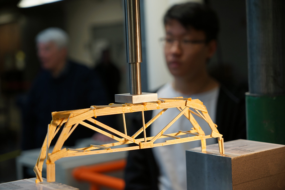 A bridge being tested at the 2018 Colorado High School Bridge Building competition.