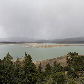 Heron Reservoir with storm clouds in the background.