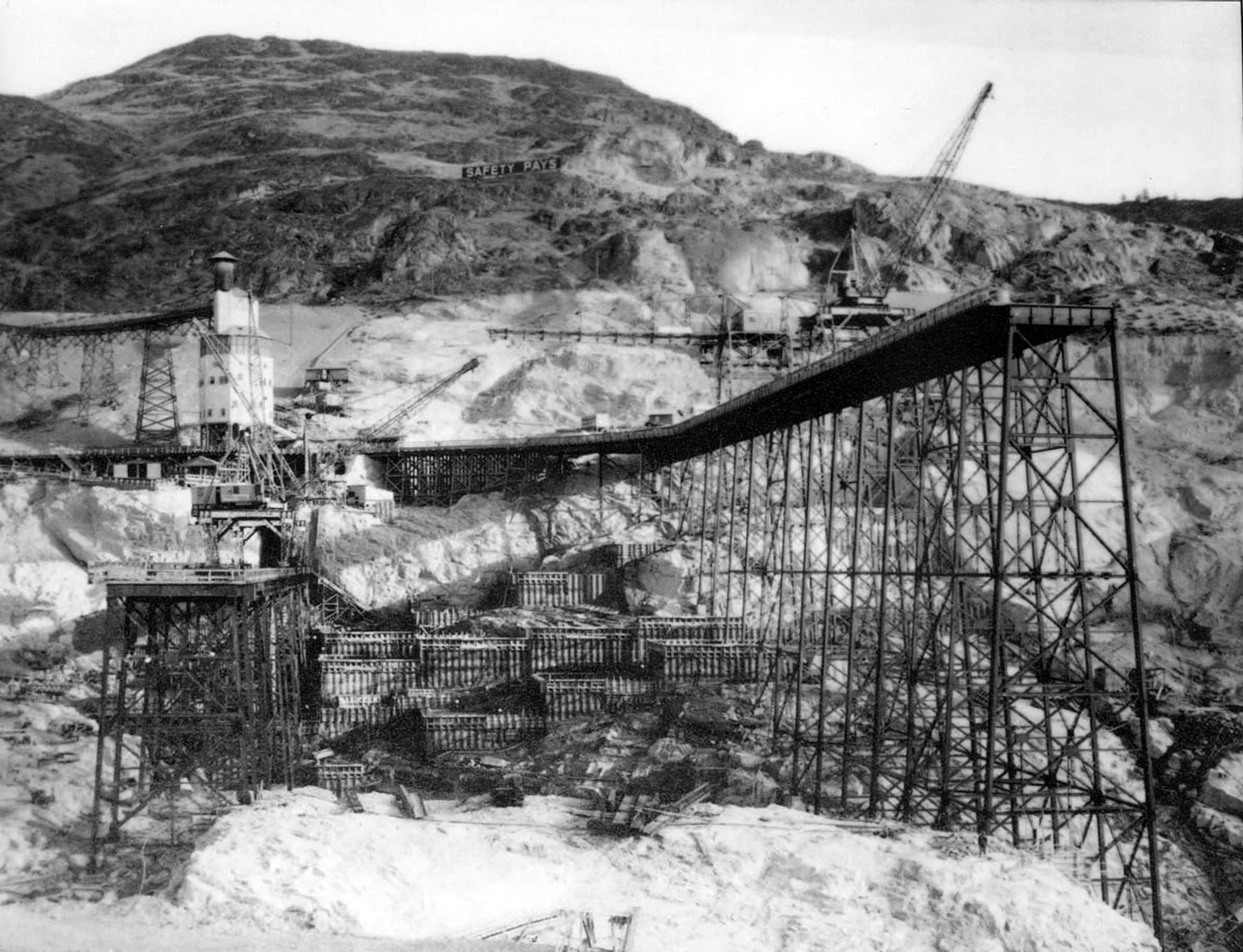 Photo taken December 19, 1936. East mix plant with high and low crane trestles on either side at Grand Coulee Dam.