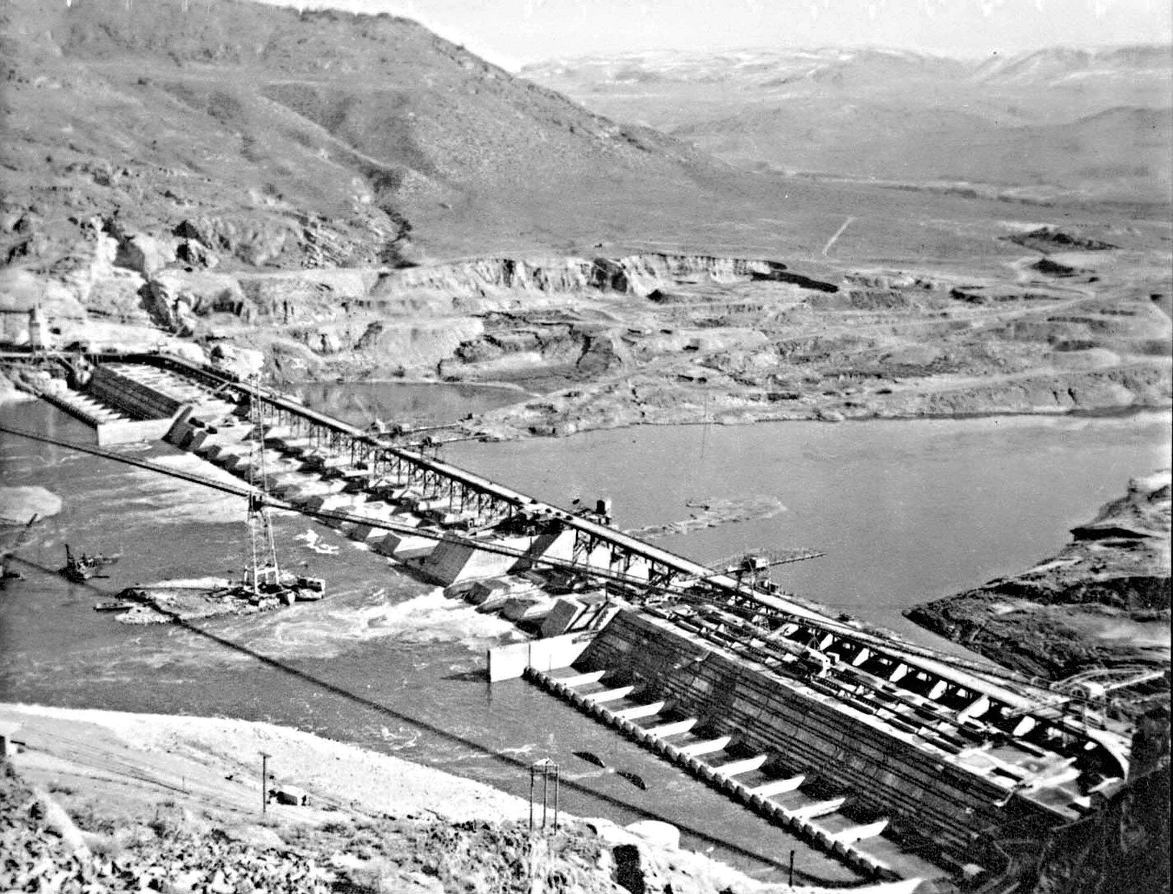 Photo taken March 8, 1938. Looking east from Fiddle Creek area at Grand Coulee Dam at the close of M.W.A.K. contract.