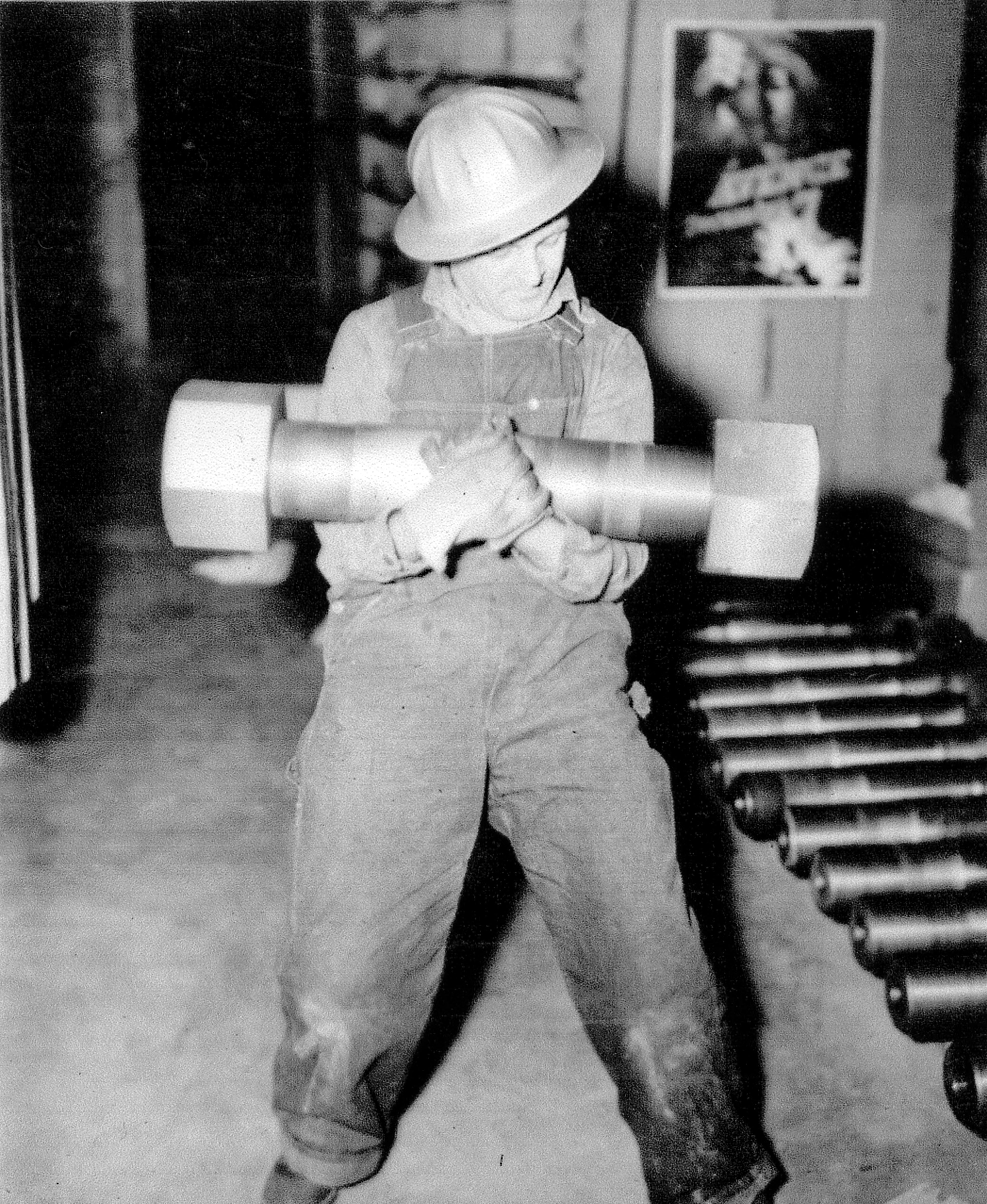 December 29, 1942. These 193 lb. bolts and nuts couple the two shafts together on a main unit at Grand Coulee Dam.