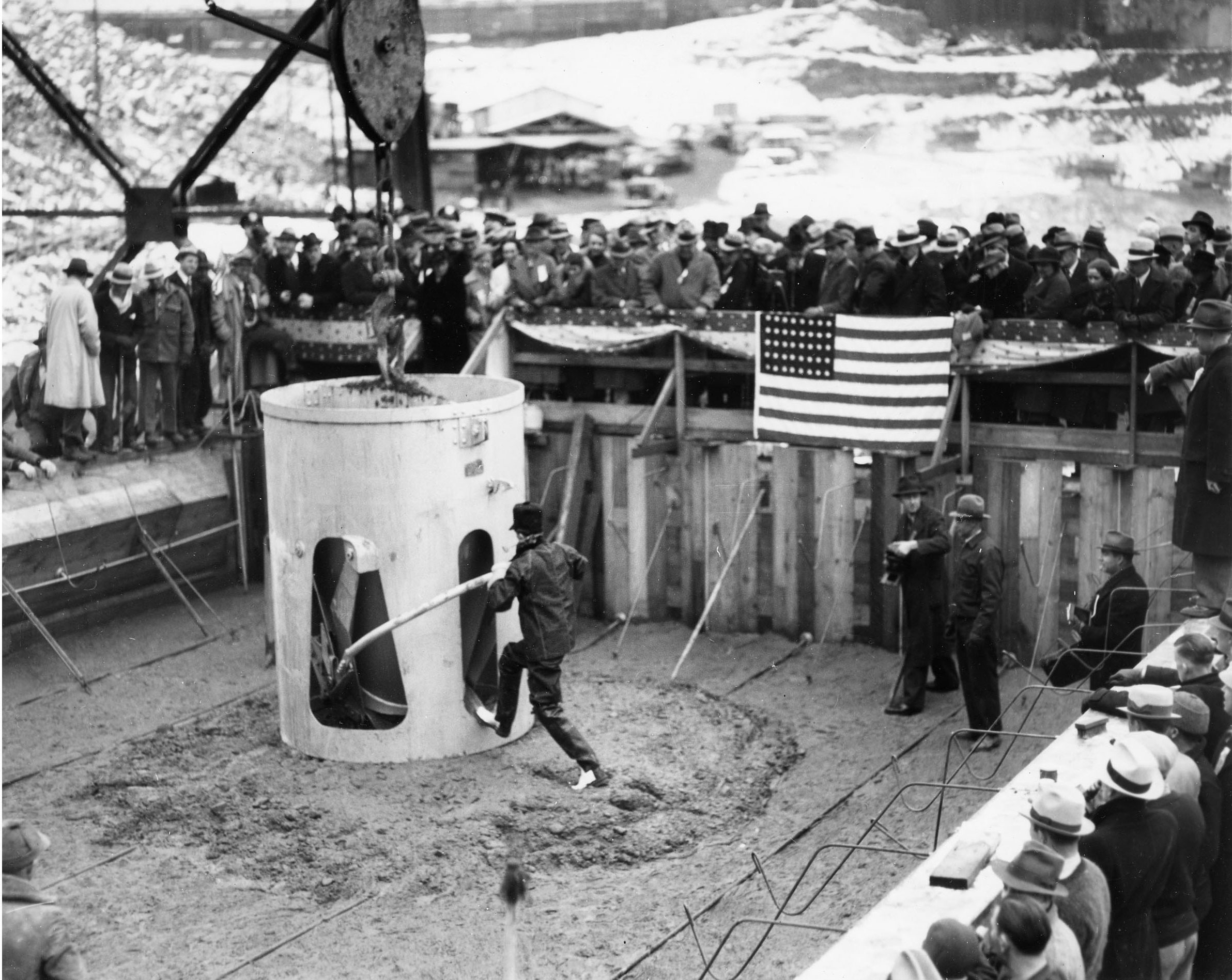 December 6, 1935. Governor Clarence C. Martin placing official first concrete pour at Grand Coulee Dam.