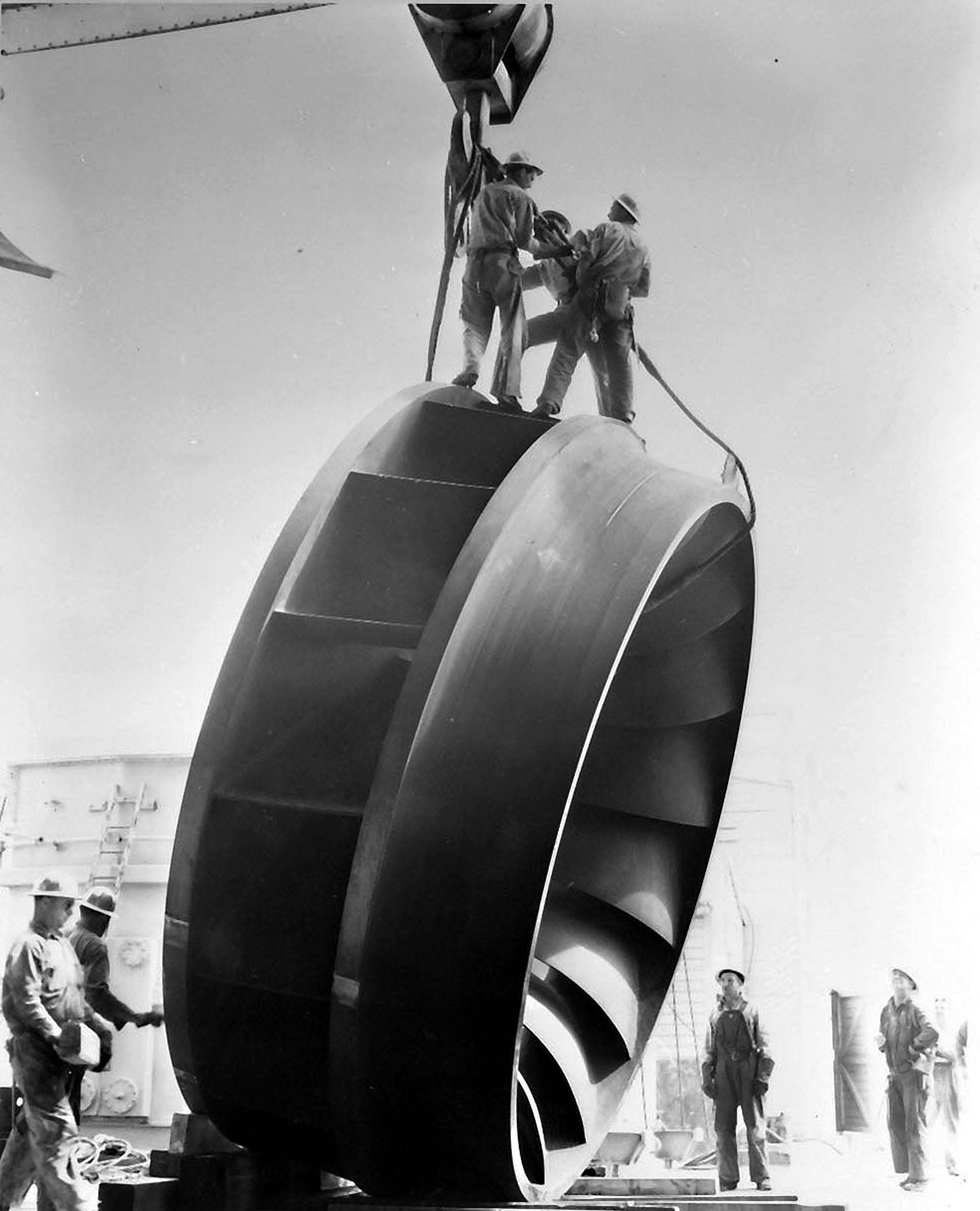 June 25, 1947. This waterwheel made by Newport news Shipbuilding and Drydock co. of Newport, Virginia just arriving at Grand Coulee Dam.