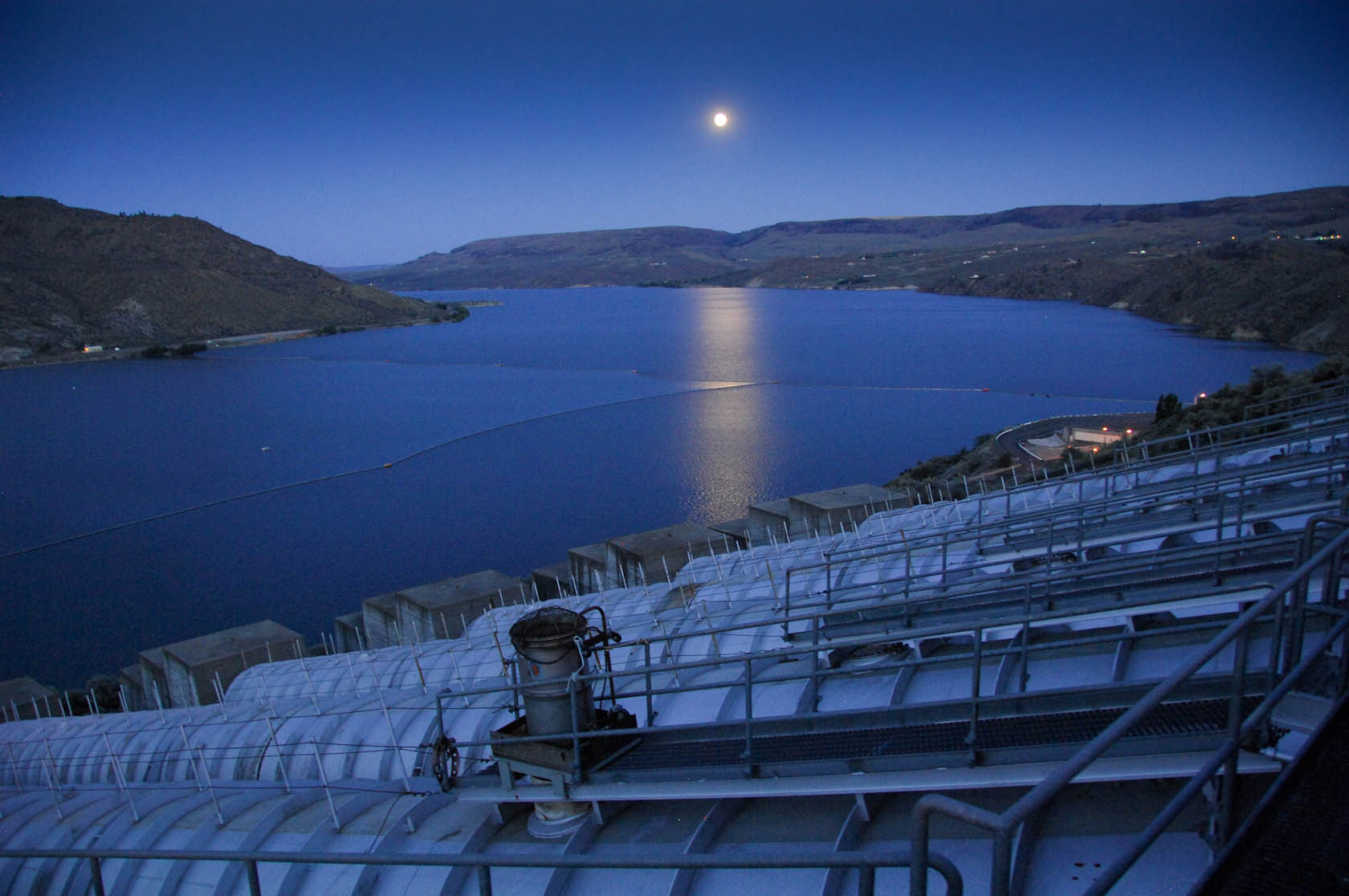 August 1, 2012. Exterior view of Grand Coulee dam and forebay from above the John Keys Pump Generation Plant intakes.