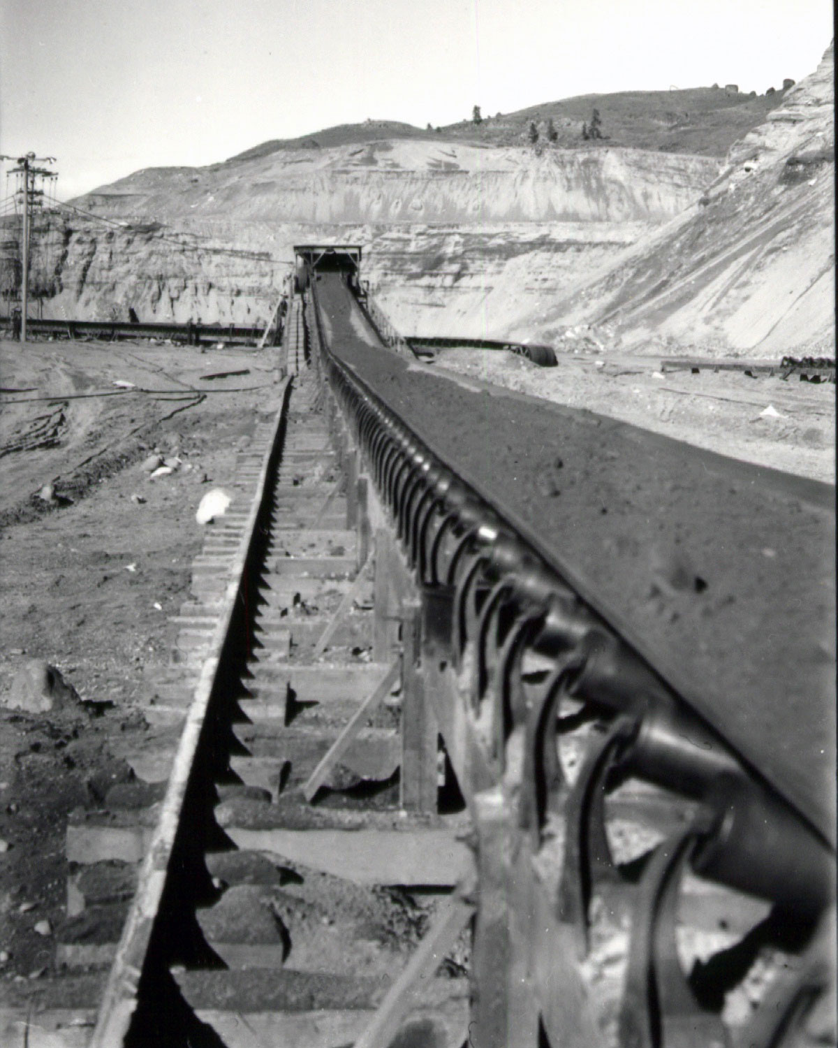 MWAK builds a huge conveyor belt—the world’s largest—to remove all the rocks and rubble from the excavation site. It is more than a mile long! 

Mason-Walsh-Atkinson-Kier (MWAK) is the name of the company that built the foundation for the dam.