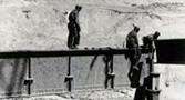 March 18, 1938. With the foundation complete, work begins on the dam structure.