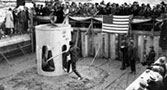 December 12, 1935. At the dam's official concrete pour, Washington Governor Clarence D. Martin tips the concrete bucket.