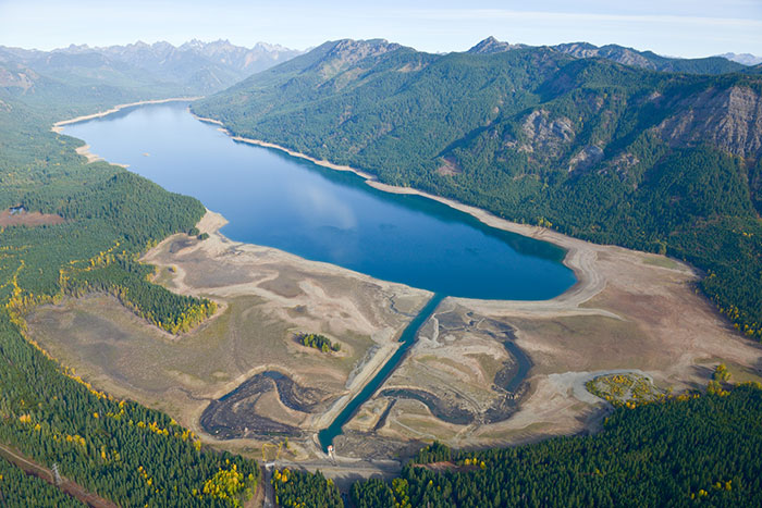 October 2015 drought at Kachess Reservoir looking at Kachess Dam and outlet works channel with the reservoir in the distance.