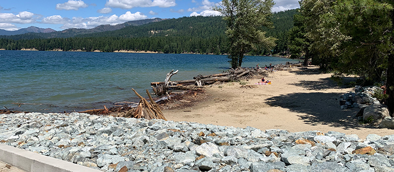 Photo of Speelyi Beach Day Use Area – A view from the new boat ramp. The anchored log structures along the water line act as a wave break to prevent erosion.