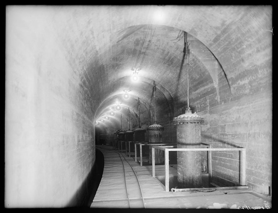 Arrowrock dam site. Portion of inspection gallery. Shows operating cylinders for sluice gates.