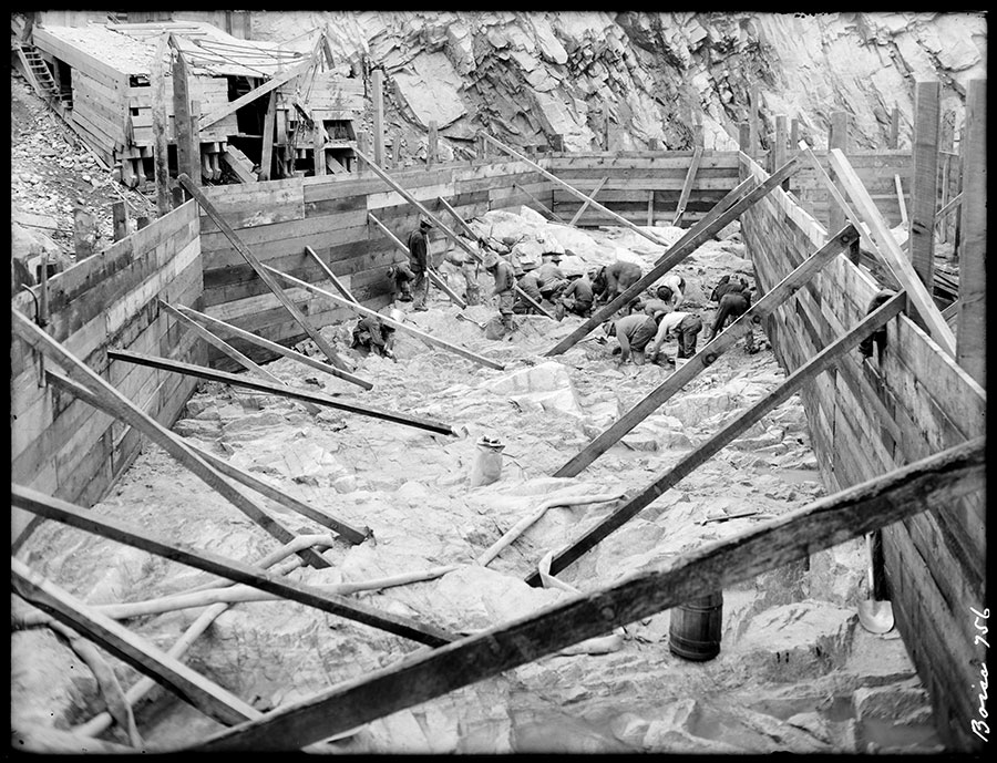 Arrowrock Dam. Final cleaning of bed rock just before placing concrete.