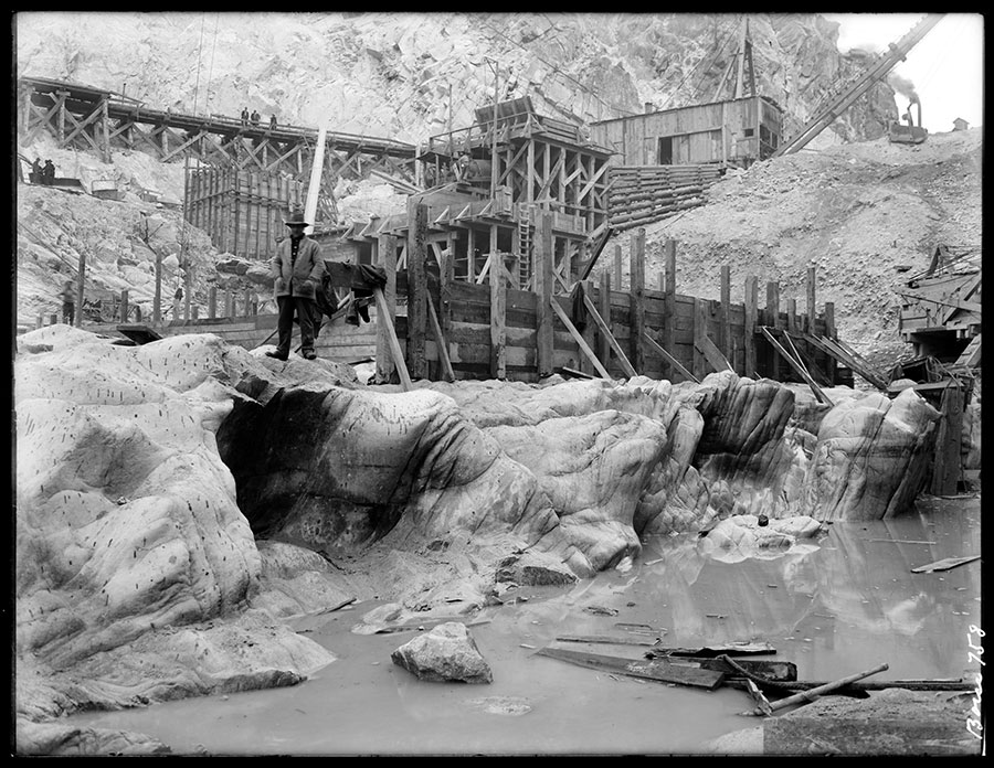 Arrowrock dam. Deep gouge in bed rock along south side. View looking northeast. Note waterworn character of rock and large pot holes.