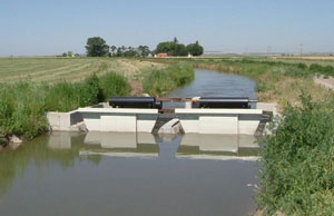 Floating water control gates maintain steady canal levels and irrigation deliveries at the Milner Irrigation District.