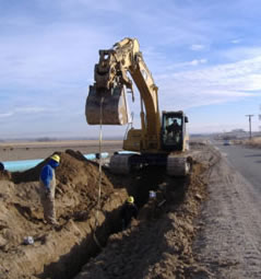 Owyhee Irrigation District crew installing pipeline to eliminate seepage losses from unlined laterals and provide gravity pressure for at farm irrigation deliveries.