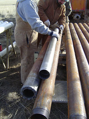 (Left) February 2004 View of soil and rock core drilling equipment, including diamond bit, inner-core barrel and drill rods.