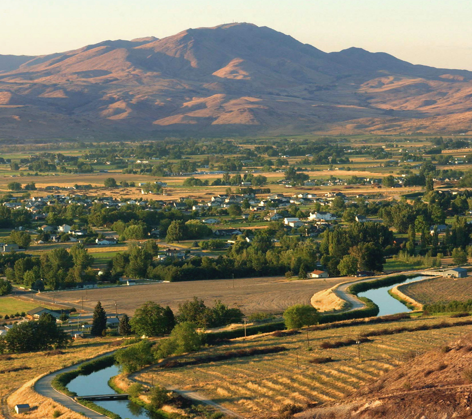 Image of canal with mountain landscape.