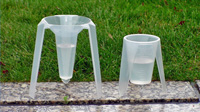 Catch cups in grass image.