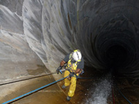 man walking into a tunnel