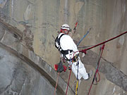 photo: Rope access team member doing repairs inside Flaming Gorge Dam spillway tunnel