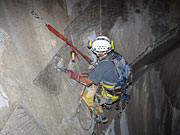 photo: Rope access team member doing repairs inside Flaming Gorge Dam spillway tunnel