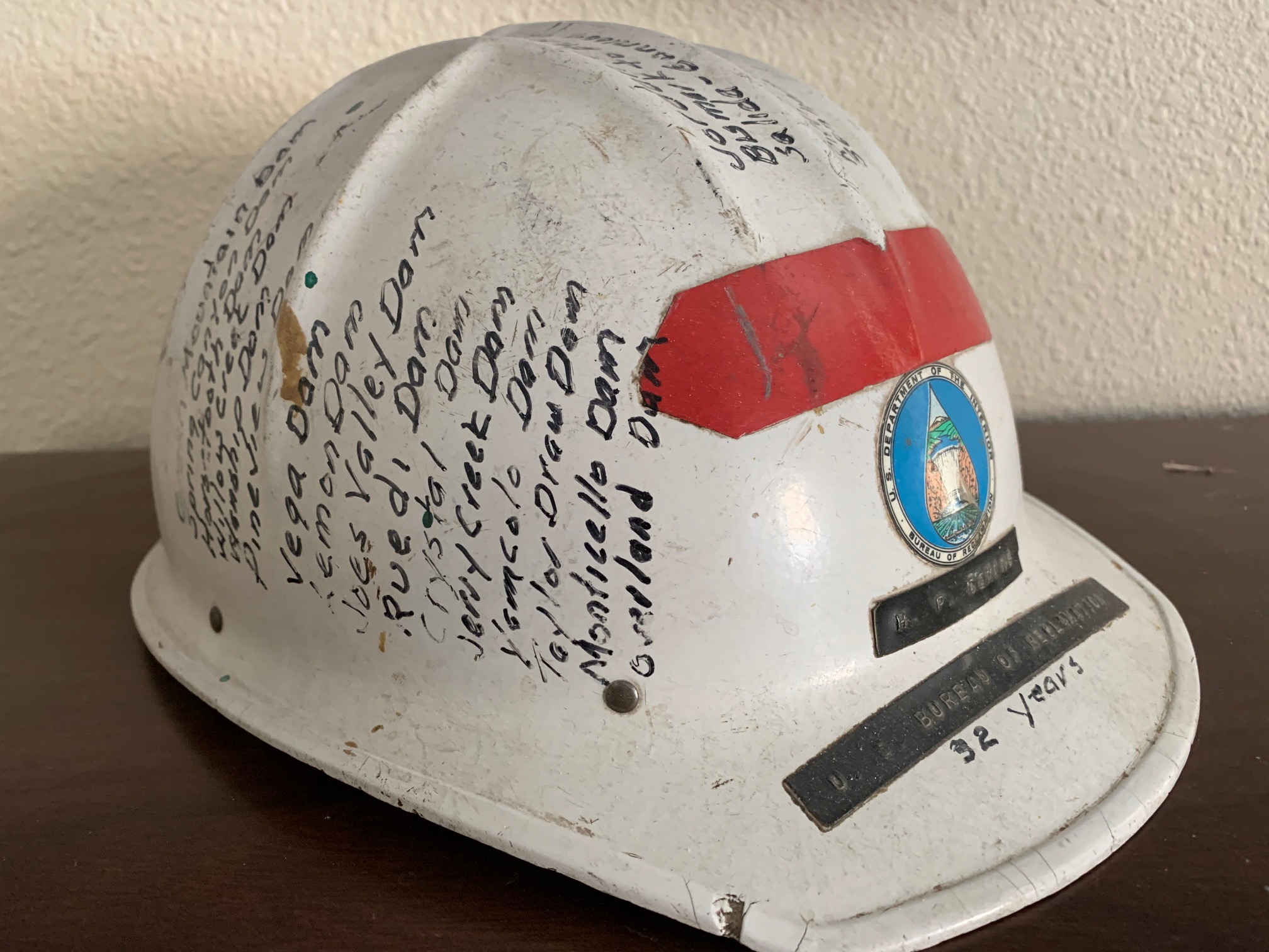  Chick’s hardhat, it was a retirement gift that lists all the dams and other facilities he worked on in his career. Bart proudly displays it in his office.