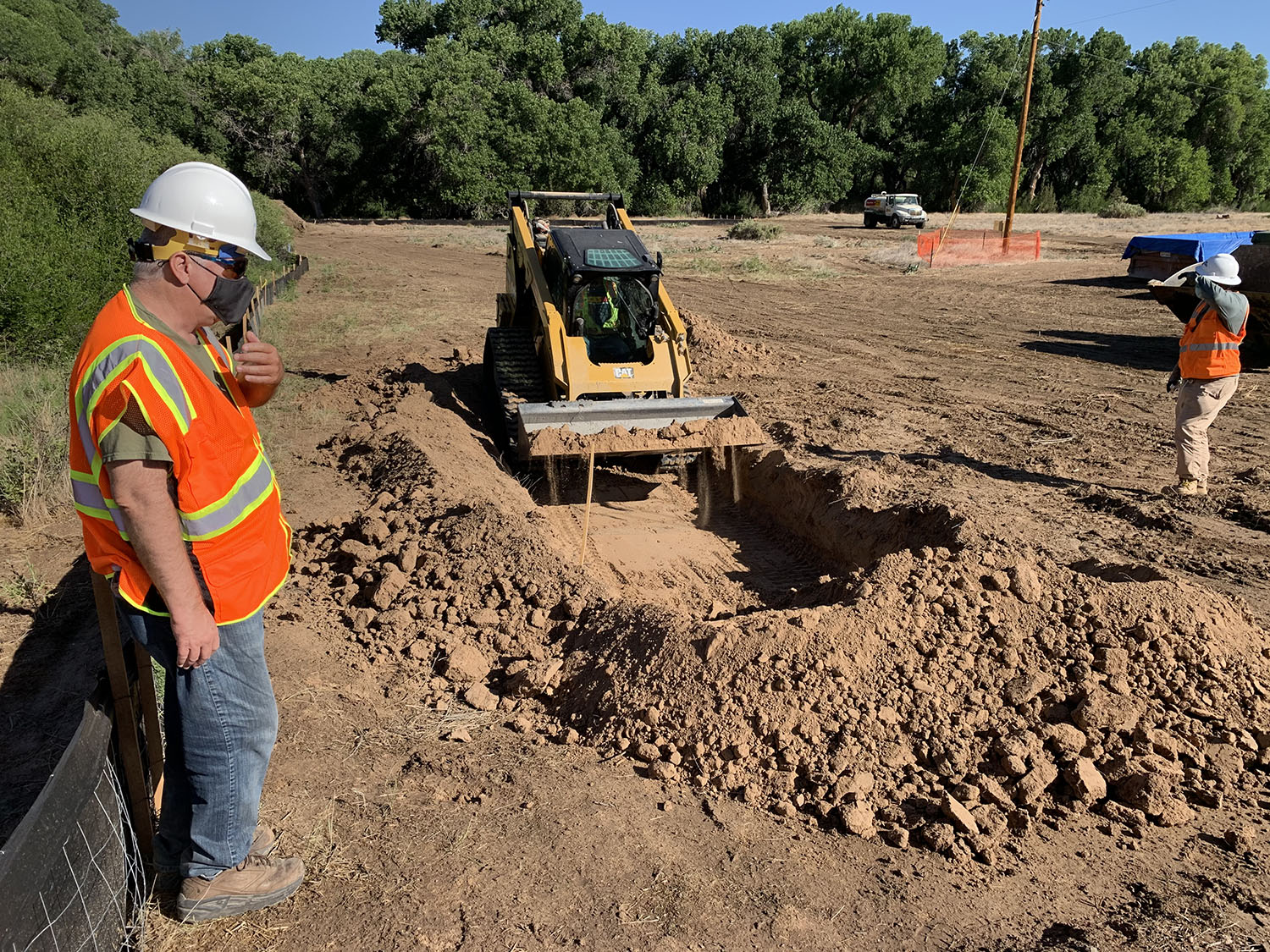 Albuquerque Area office Archaeologist Larry Moore oversees initial excavation at the PBRWS construction site. 