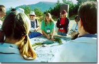 photo: teachers watching outdoor demonstration at conservation workshop