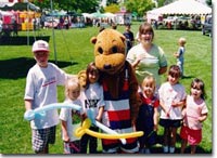 photo: children at water conservation fair with Otto Otter mascot