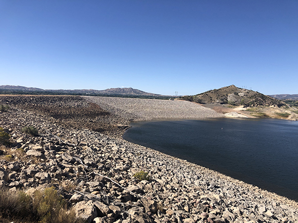 View from left abutment looking the the reconstructed right abutment embankment and outlet works at Steinaker Dam.