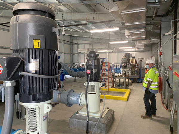 Reclamation employee inspects the treated water and backwash pumps located in the treated water pump station building at the Cutter Lateral Water Treatment Plant